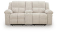 Ashley Furniture Orlen reclining loveseat with console, showing plush fabric, cushioned armrests, and built-in center console.