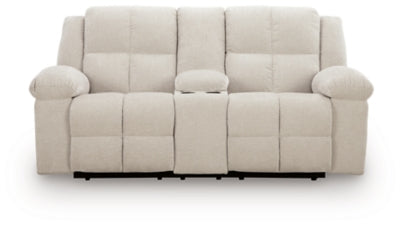 Ashley Furniture Orlen reclining loveseat with console, showing plush fabric, cushioned armrests, and built-in center console.