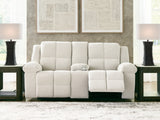 Ashley Furniture Orlen reclining loveseat with console, showing plush upholstery and built-in cupholders in a relaxed open position.