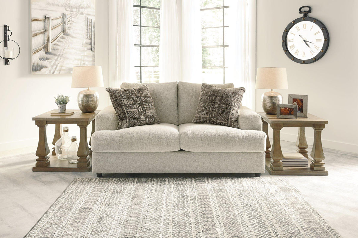 Ashley Furniture Soletren loveseat in gray fabric with plush cushions and tapered wood legs, perfect for modern living rooms.
