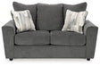 Ashley Furniture Stairatt loveseat showing plush fabric upholstery and cushioned backrest in a cozy living room setting.