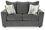 Ashley Furniture Stairatt loveseat showing plush fabric upholstery and cushioned backrest in a cozy living room setting.