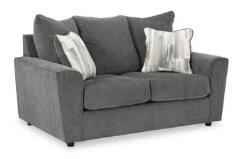 Ashley Furniture Stairatt loveseat with plush fabric upholstery and cushioned armrests in a contemporary living room setting.