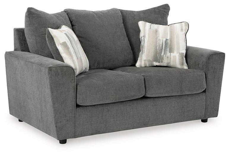 Ashley Furniture Stairatt loveseat in neutral fabric, featuring plush cushions and modern design for comfortable seating.
