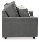 Ashley Furniture Stairatt loveseat showing plush fabric, cushioned backrest, and cozy seating in a modern living room setting.