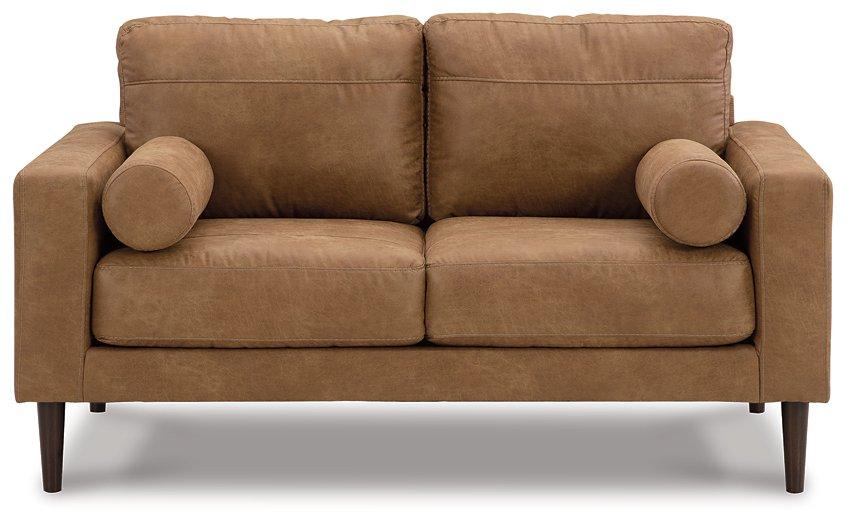Ashley Telora loveseat with plush fabric upholstery, featuring comfortable cushions and a modern design.