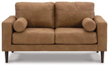 Ashley Telora loveseat with plush fabric upholstery, featuring comfortable cushions and a modern design.