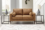 Ashley Telora loveseat featuring plush cushions and a modern design in a neutral fabric, perfect for living room seating.