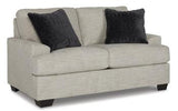 Ashley Vayda Loveseat with plush upholstery and contemporary design, perfect for cozy living room seating.