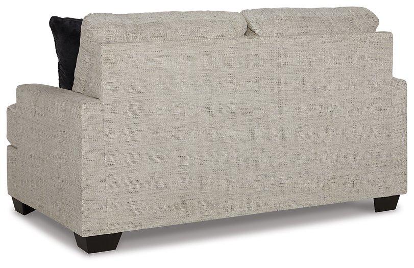 Ashley Vayda Loveseat with plush upholstery and modern design, perfect for contemporary living room seating.