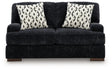 Ashley Furniture Whitmore Manor loveseat with plush fabric and rolled arms, shown from a head-on view.
