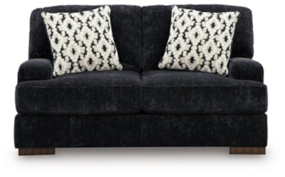 Ashley Furniture Whitmore Manor loveseat with plush fabric and rolled arms, shown from a head-on view.