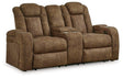 Ashley Furniture Wolfridge power reclining loveseat with plush fabric, cushioned armrests, and built-in recline mechanism.