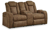 Ashley Furniture Wolfridge power reclining loveseat with plush fabric, cushioned armrests, and built-in recline mechanism.