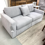 Ashley Furniture Modmax modular loveseat in granite fabric, two-piece sectional with plush cushions and modern design.