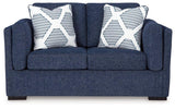 Ashley Furniture Evansley loveseat with plush fabric and cushioned arms, perfect for cozy living room seating.