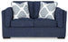Ashley Furniture Evansley loveseat with plush fabric and cushioned arms, perfect for cozy living room seating.