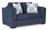 Ashley Furniture Evansley loveseat with plush fabric and cushioned armrests, ideal for cozy living room seating.