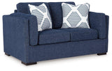 Ashley Furniture Evansley loveseat with plush fabric, cushioned armrests, and a stylish, modern design for comfortable seating.