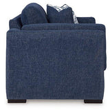 Ashley Furniture Evansley loveseat with plush cushions and a stylish fabric upholstery, perfect for cozy living room seating.