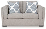 Ashley Furniture Evansley loveseat with plush fabric, cushioned back and armrests, in a cozy, stylish living room setting.