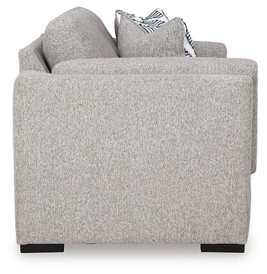 Ashley Furniture Evansley loveseat showing plush fabric upholstery and cushioned armrests in a cozy living room setting