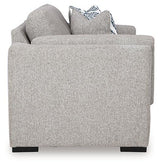 Ashley Furniture Evansley loveseat showing plush fabric upholstery and cushioned armrests in a cozy living room setting