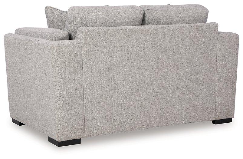 Ashley Furniture Evansley loveseat with plush fabric, cushioned armrests, and a stylish, contemporary design for cozy living rooms.