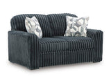 Ashley Furniture Midnight-Madness loveseat with plush fabric and modern design, shown from an angled view.