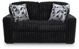 Ashley Furniture Midnight-Madness Loveseat with plush dark fabric, cozy cushions, and modern design in a stylish living room setting.