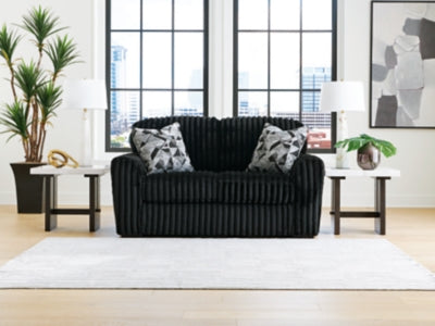 Ashley Furniture Midnight-Madness loveseat with plush fabric and sleek design, perfect for modern living room seating.