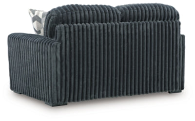 Ashley Furniture Midnight-Madness Loveseat with plush fabric and stylish back design, perfect for cozy living room seating.