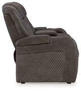 Ashley Furniture Fyne-Dyme Power Reclining Loveseat with Console, showing plush upholstery and built-in cup holders from the side view.