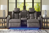 Ashley Furniture Fyne-Dyme power reclining loveseat with console, showing plush fabric, built-in cup holders, and reclining features.