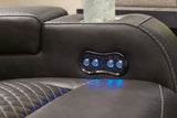 Ashley Furniture Fyne-Dyme Power Reclining Loveseat with Console, featuring cushioned seats and built-in control panel for comfort.