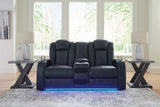 Ashley Furniture Fyne-Dyme Power Reclining Loveseat with Console, featuring plush upholstery and built-in cup holders on the armrest.