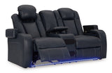 Ashley Furniture Fyne-Dyme power reclining loveseat with console, showing the open reclined position and plush fabric upholstery.