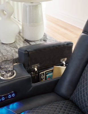 Ashley Furniture Fyne-Dyme power reclining loveseat with console, showing plush fabric, armrests, and built-in cup holders.