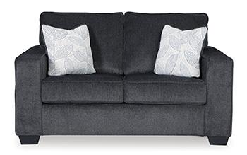 Ashley Furniture Altari loveseat showing plush beige fabric, cushioned backrest, and wooden legs in a cozy living room setting.