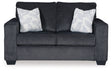 Ashley Furniture Altari Loveseat with plush fabric and modern design, shown in a cozy living room setting.