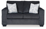 Ashley Furniture Altari Loveseat with plush fabric and modern design, shown in a cozy living room setting.
