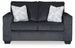 Ashley Furniture Altari Loveseat with plush fabric and modern design, shown in a cozy living room setting.