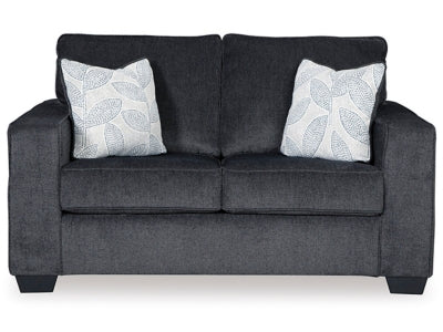 Ashley Furniture Altari Loveseat with plush upholstery and wooden legs, shown in a cozy living room setting.
