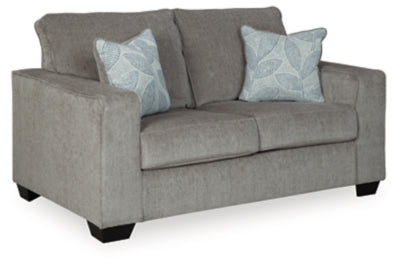 Ashley Furniture Altari loveseat shown from an angle, featuring plush fabric upholstery and a comfortable, stylish design.