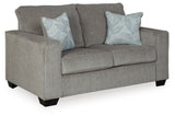 Ashley Furniture Altari loveseat shown from an angle, featuring plush fabric upholstery and a comfortable, stylish design.