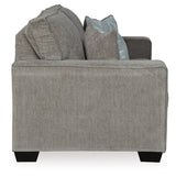 Ashley Furniture Altari loveseat with plush fabric and cushioned armrests, shown from a side angle.