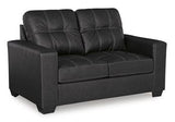 Ashley Furniture Barlin Mills loveseat with plush fabric and cushioned armrests, perfect for cozy living room seating.