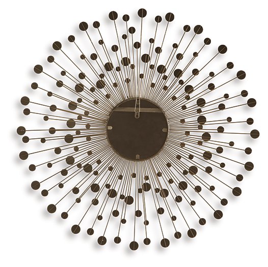 Ashley Furniture Morwenna accent mirror with a decorative frame, hanging on a wall in a modern interior setting.