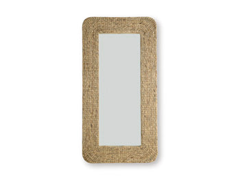 Ashley Furniture Norigan floor mirror with a sleek, full-length design and a modern frame, standing upright in a stylish room.