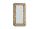 Ashley Furniture Norigan floor mirror with a sleek, full-length design and a modern frame, standing upright in a stylish room.